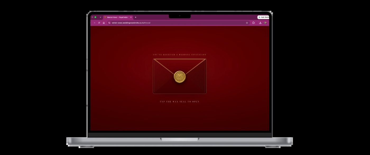 Velvet Vows maroon and gold wax-seal digital wedding invitation website preview on a laptop